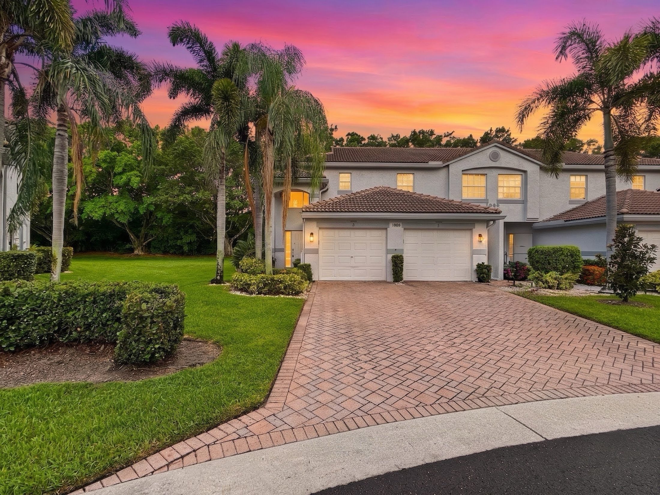 7880 Laina Lane #3 Boynton Beach — front exterior at dusk