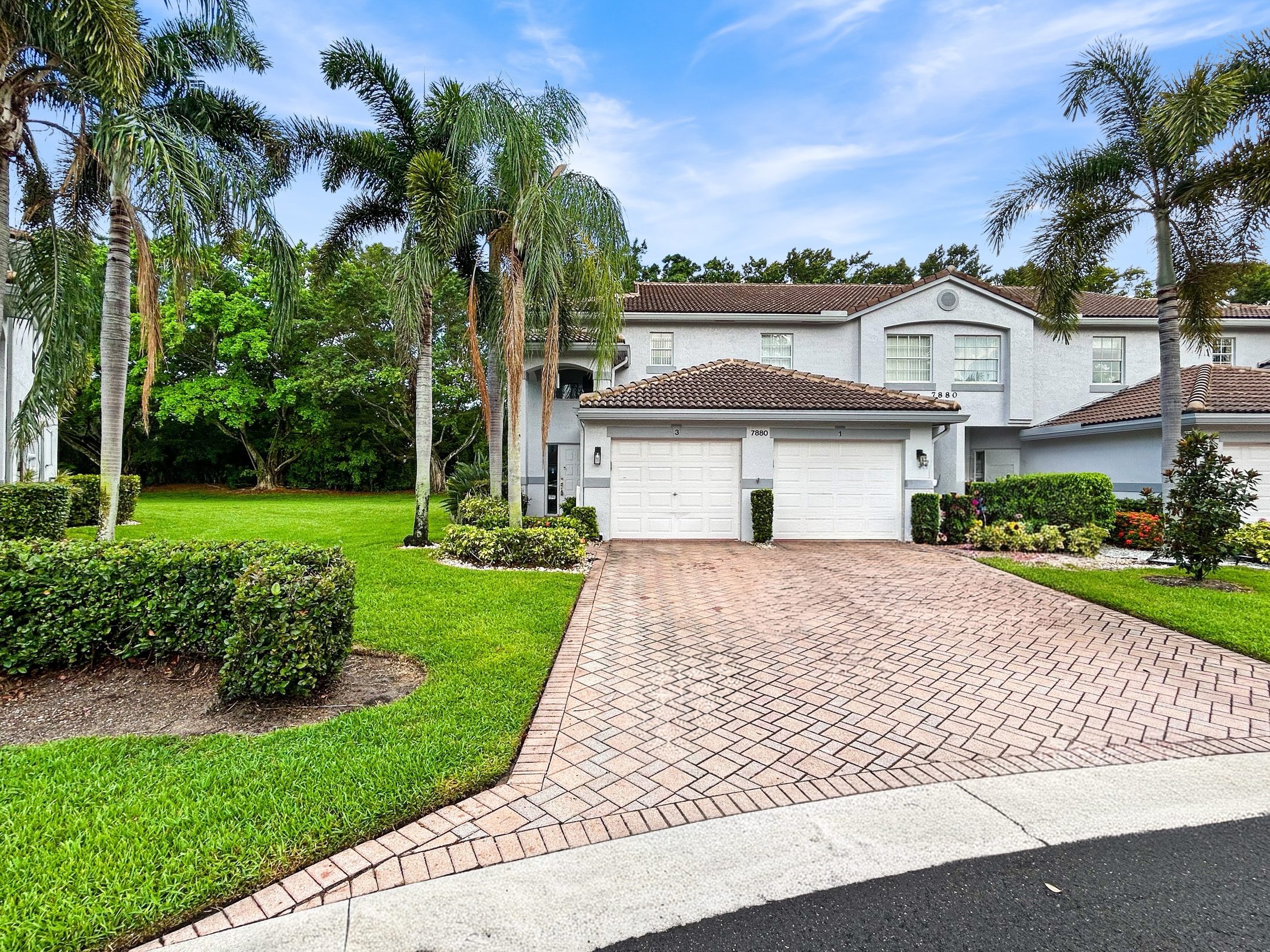 7880 Laina Lane #3 Boynton Beach — front exterior daytime with paver driveway