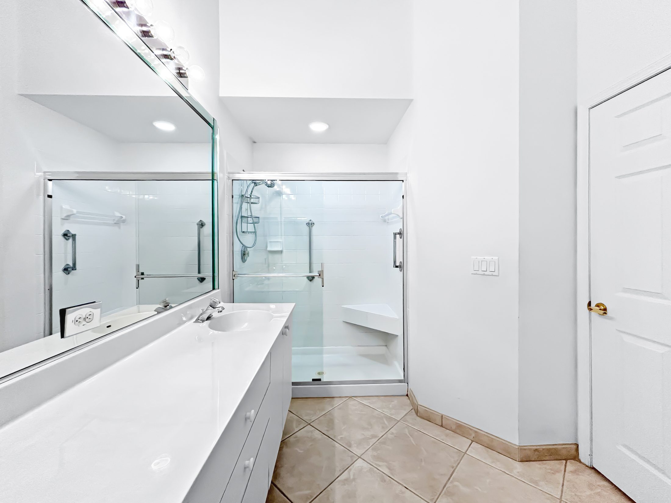 7880 Laina Lane #3 Boynton Beach — bathroom with walk-in glass shower