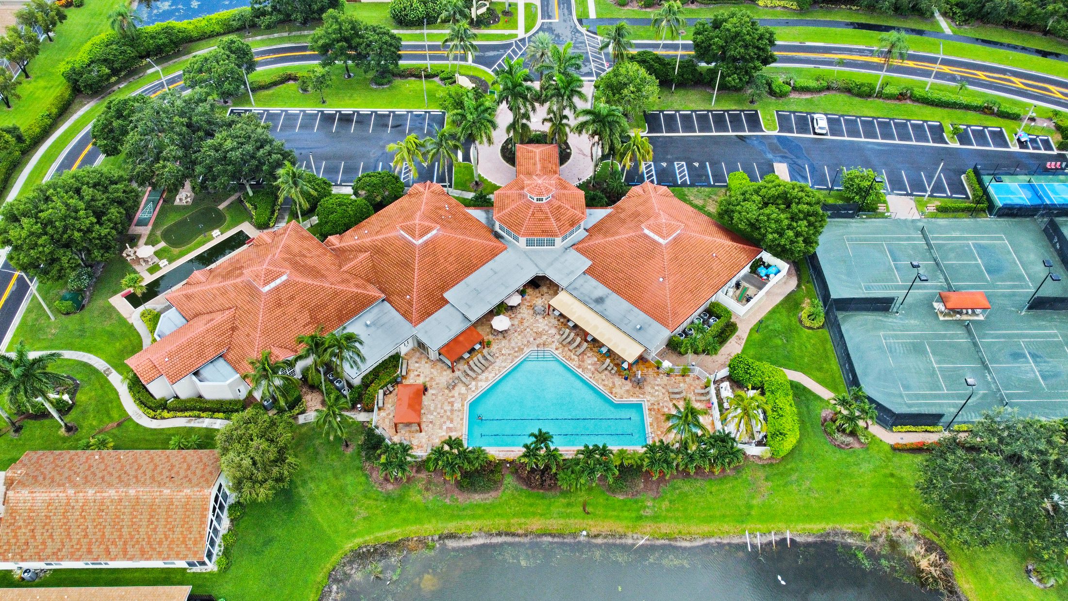 Grove Village community aerial — clubhouse, pool and tennis courts