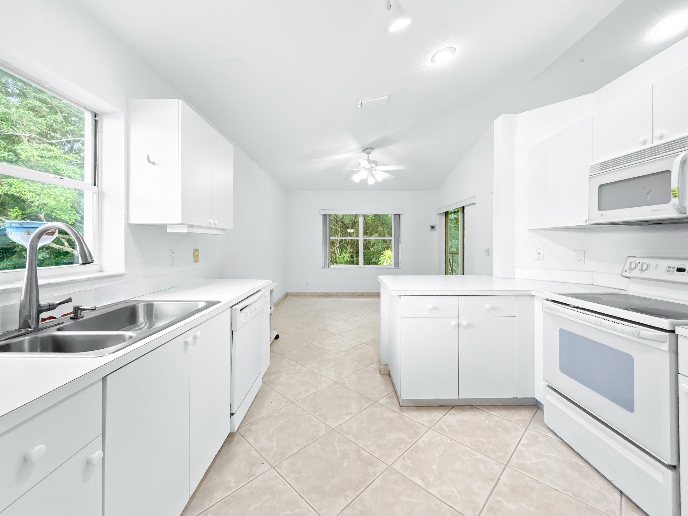 7880 Laina Lane #3 — kitchen with vaulted ceiling and natural light