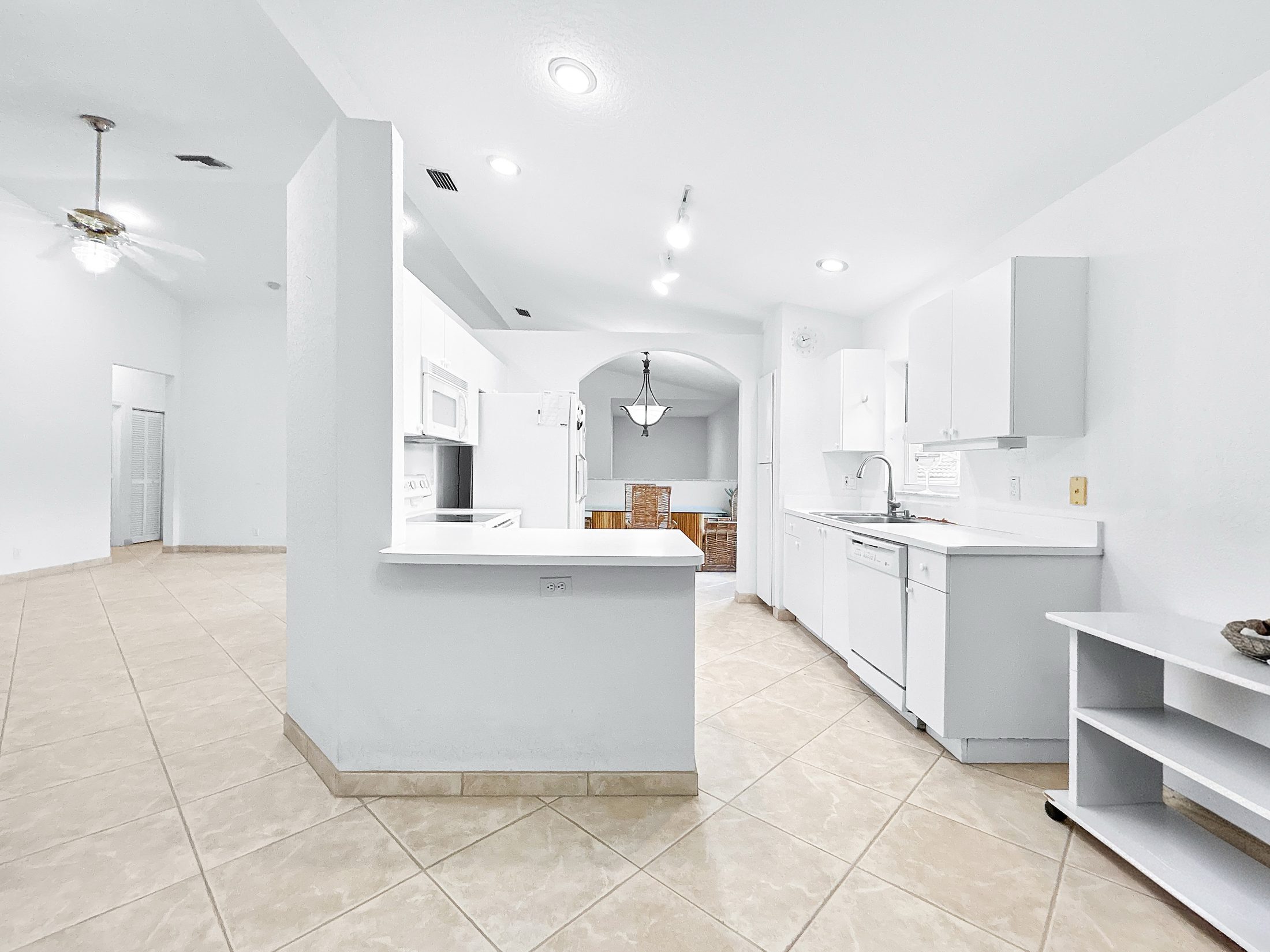 7880 Laina Lane #3 — kitchen peninsula opening to living area