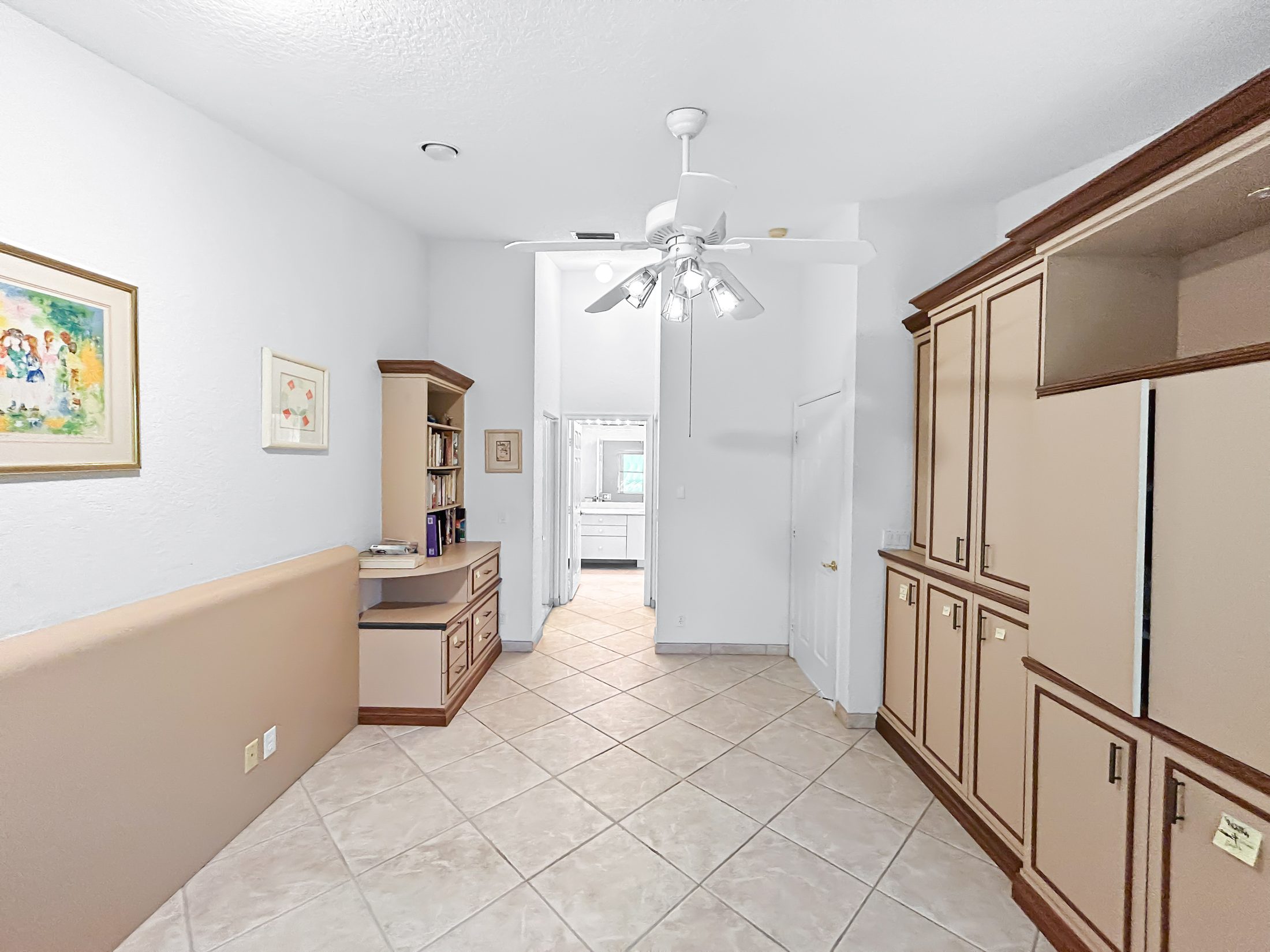 7880 Laina Lane #3 — upstairs landing with built-in cabinetry